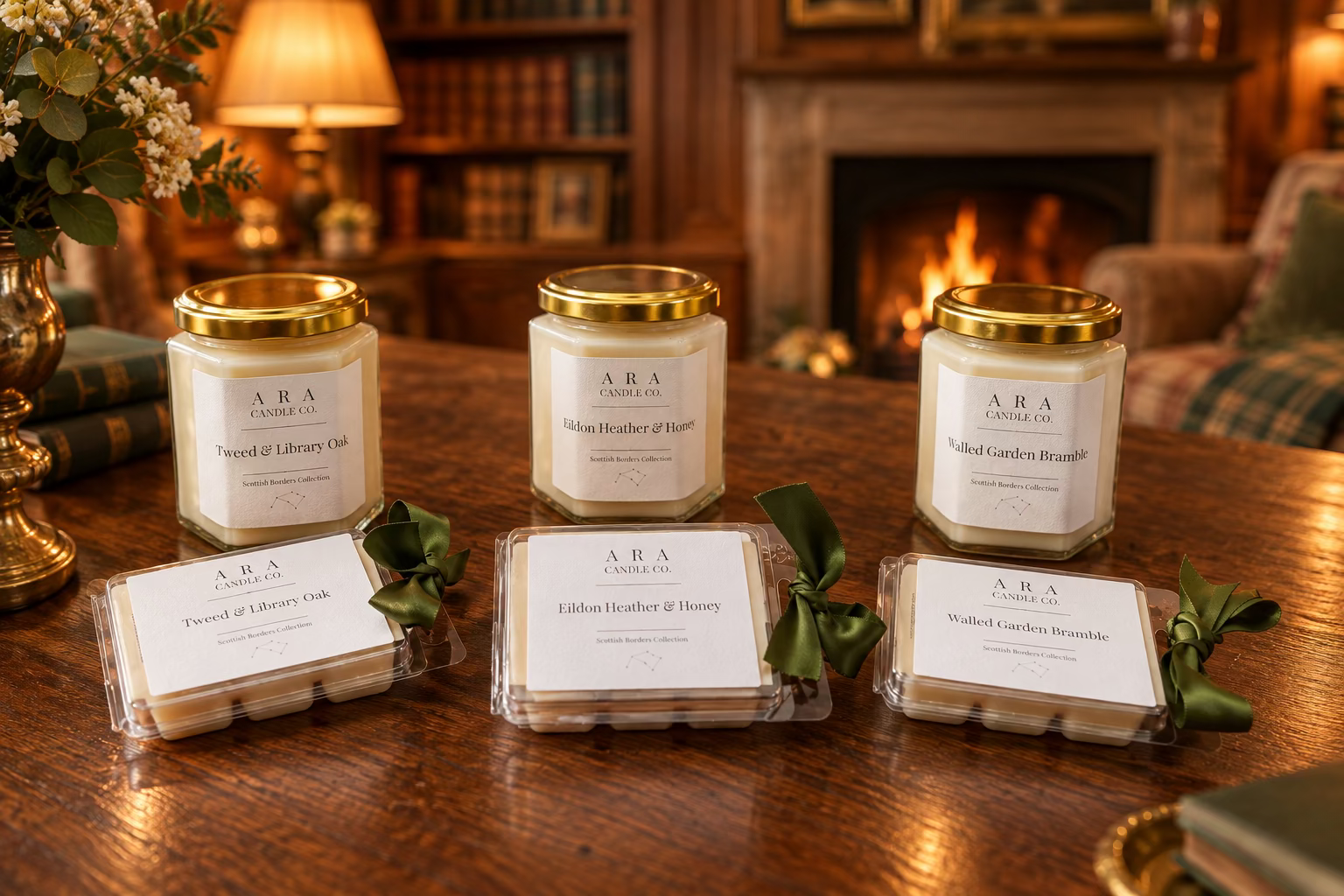 Three wax melts and three candles from ARA Candle Co. arranged on a wooden table.
